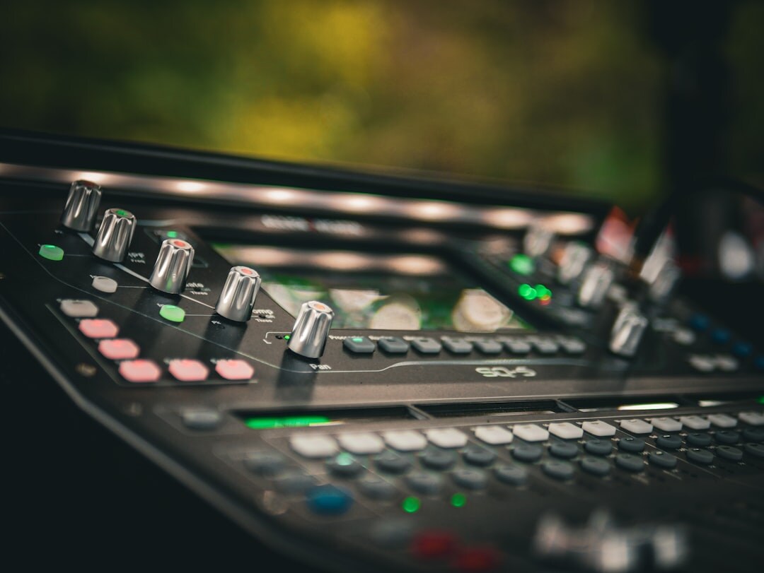 Close up of broadcast switcher console with glowing buttons
